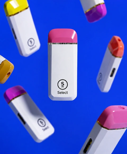 Eight Briq devices in different colourways, scattered on blue