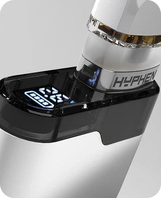 A pod seating into the Hyphen battery, its display lit